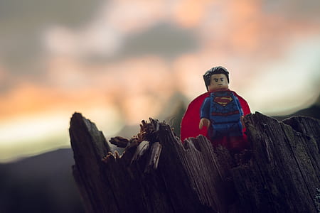 Lego Superman minifigure on brown wooden surface thumbnail