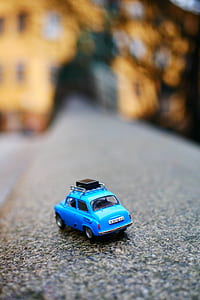 selective focus photography of blue 3-door hatchback die-cast metal scale model thumbnail