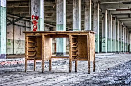 brown wooden desk inside building thumbnail