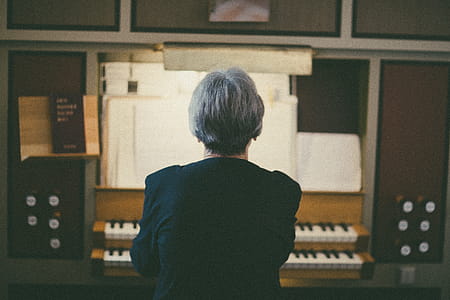 Back View of Woman Playing Organ thumbnail