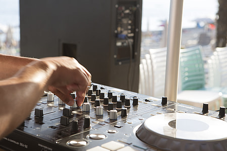 person using black DJ audio mixer thumbnail