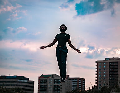 selective focus photography of jumping man thumbnail