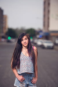photo of woman standing on road thumbnail