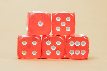five orange dice on white surface thumbnail