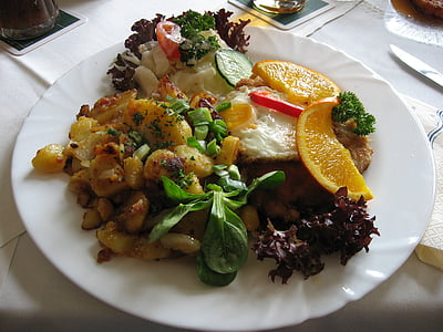 cooked food with sliced orange fruit on platge thumbnail