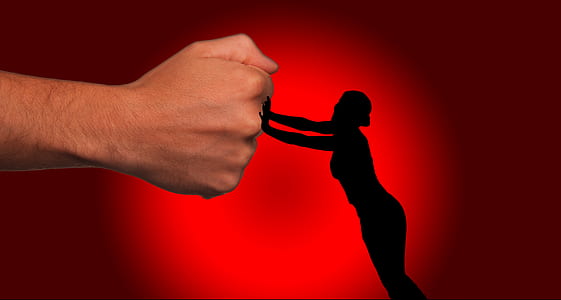 silhouette of person holding person's fist thumbnail