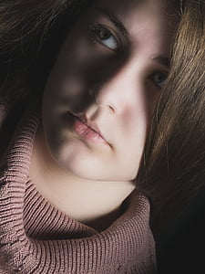 women looking up wearing gray knit top thumbnail