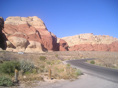 road near rock formation thumbnail