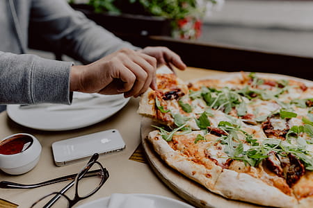 Eating delicious pizza in a cozy restaurant thumbnail