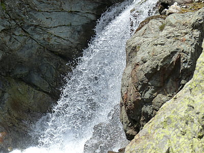 waterfalls beside mountain thumbnail
