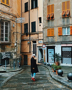 person standing in the middle of walk path thumbnail