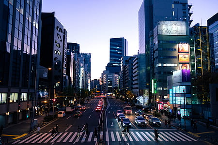 group of people walking on pedestrian lain beside car thumbnail
