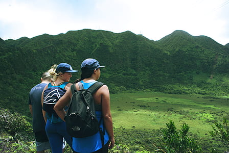 three person on top of hill thumbnail