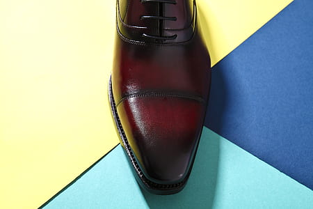 unpaired brown and black leather dress shoe thumbnail