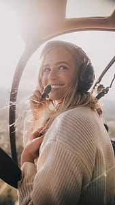 woman using headset inside the plane thumbnail