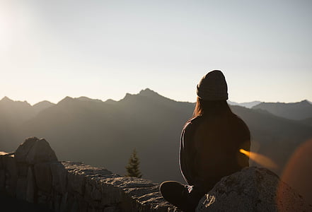 silhouette of person on rock mountain thumbnail