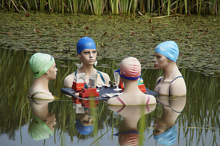 four statue in body of water thumbnail