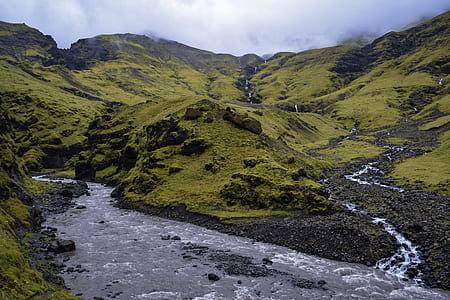 river and green mountains under white clouds thumbnail