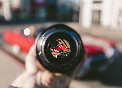tilt shift lens photography of red car thumbnail