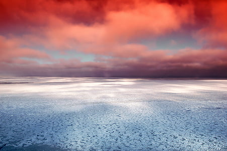 grey sand under red cloudy sky thumbnail