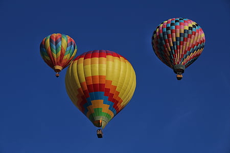 three multicolored hot air balloons on flight thumbnail