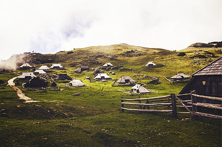 photo of brown huts on mountain thumbnail