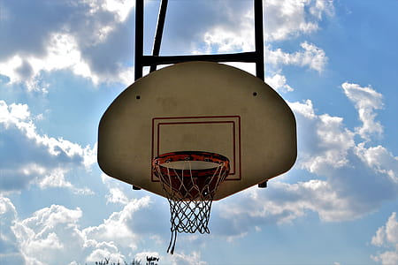 white and black basketball hoop under bue sky at daytime thumbnail