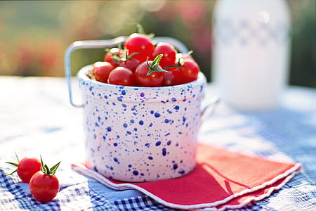 cherry tomatoes on white and blue ceramic container thumbnail