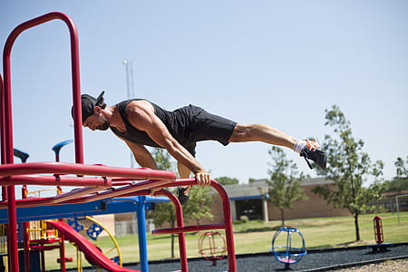 man exercising on red ladder thumbnail