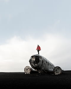 man standing on aircraft thumbnail
