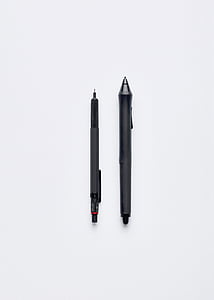 two black retractable pens on white surface thumbnail