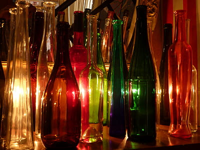 standing assorted-color clear glass bottles thumbnail