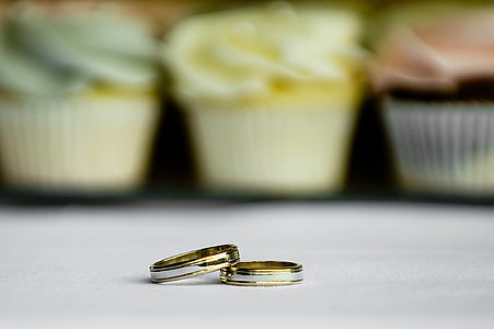 two gold-colored rings thumbnail