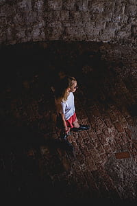woman walking on brown pavement thumbnail