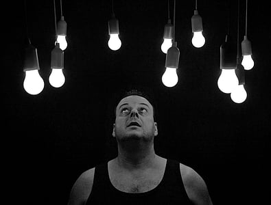 grayscale photo of man looking above thumbnail