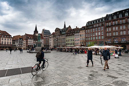 people walking and standing beside buildings thumbnail