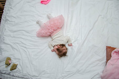 baby prone lying on bed thumbnail