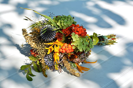 green and red flower bouquet on white wood thumbnail