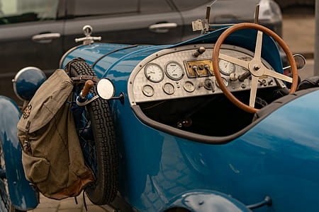 selective focus photography of classic blue vehicle thumbnail