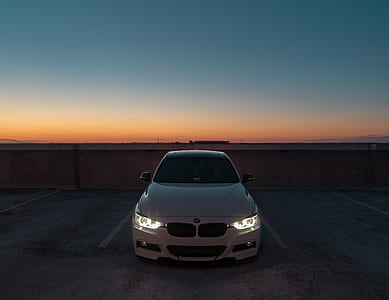 selective focus photography of white BMW car thumbnail