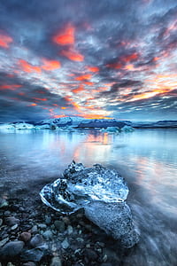 panoramic photography of ice burgs on body of water thumbnail