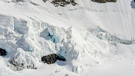 aerial view of mountain filled with snow during daytime thumbnail