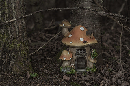 mushroom house miniature near tree thumbnail