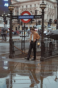 man standing on underground subway thumbnail
