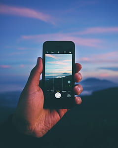 person taking photo of clear blue sky thumbnail