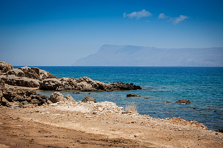 stones near sea at daytime thumbnail
