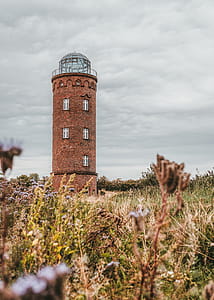 Brown Concrete Tower on Green Grass Field thumbnail
