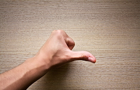 person raising left thumb thumbnail