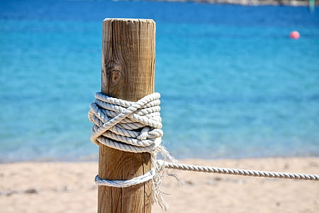 rope tied on wooden pole thumbnail