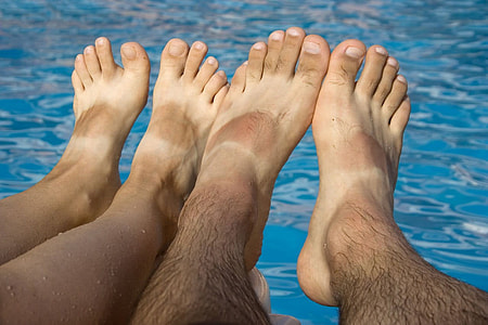 photo of person's feet near pool thumbnail